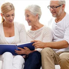 Family looking at a book