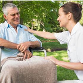 Nurse talking to a resident outside